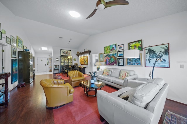 living room featuring lofted ceiling, a textured ceiling, hardwood / wood-style flooring, and ceiling fan