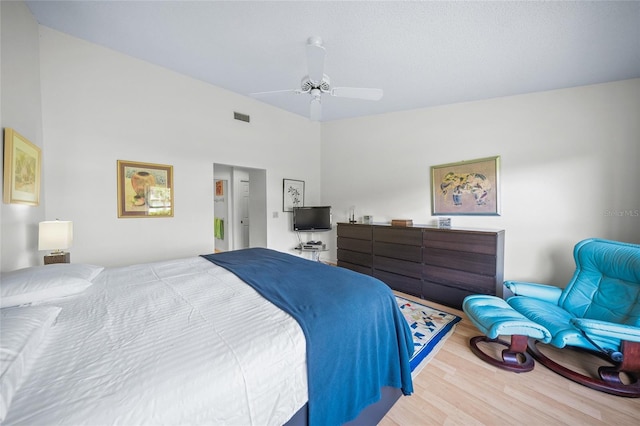 bedroom with hardwood / wood-style floors and ceiling fan