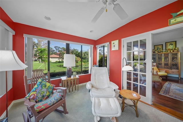 sunroom / solarium with ceiling fan and lofted ceiling