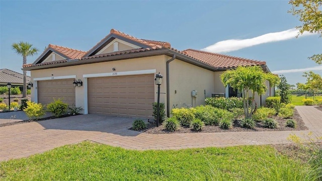 view of home's exterior featuring a garage and a yard