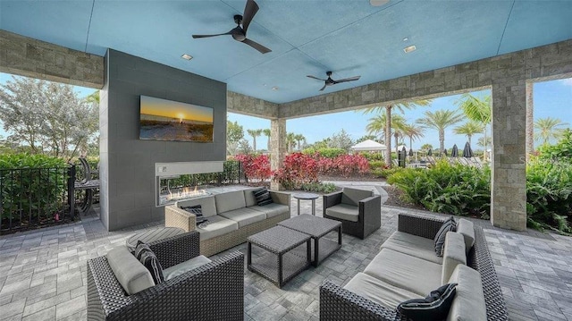 view of patio / terrace featuring ceiling fan and outdoor lounge area