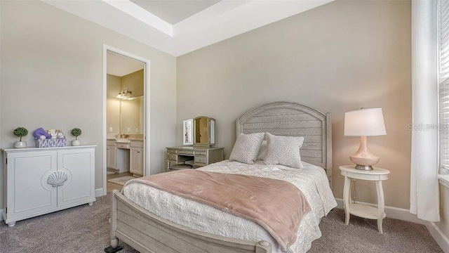 carpeted bedroom with ensuite bathroom