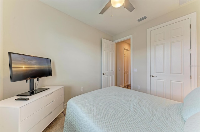 carpeted bedroom with ceiling fan