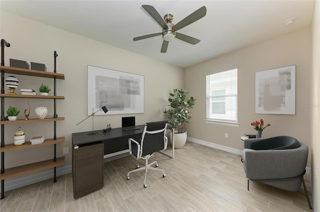 office space featuring light wood-type flooring and ceiling fan