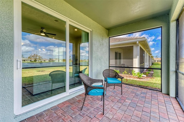 sunroom / solarium with ceiling fan