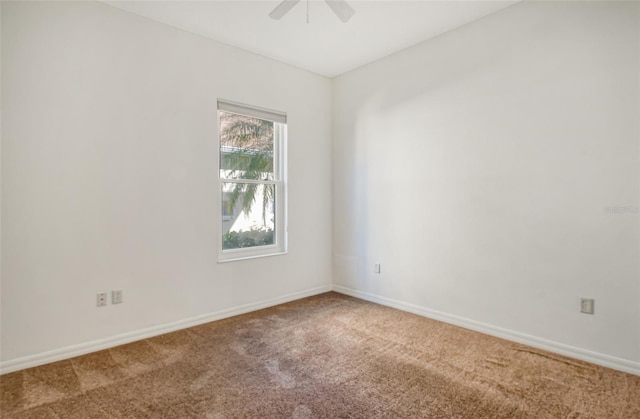 empty room featuring ceiling fan and carpet floors