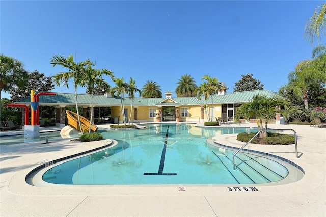 view of swimming pool with a patio