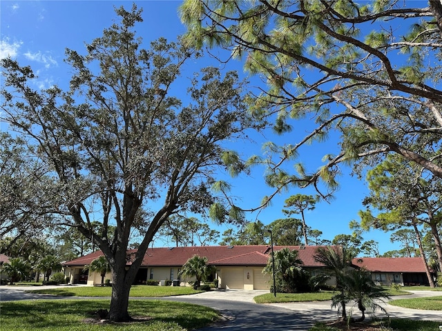 3711 Pinecone Ct Unit 168, Sarasota, FL 34238 - single story home featuring a garage, a front lawn, and concrete driveway