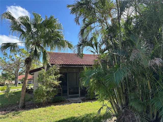 3711 Pinecone Ct Unit 168, Sarasota, FL 34238 - view of front of home with a tile roof, a front yard, and stucco siding