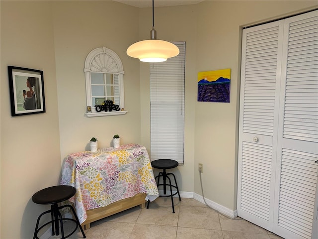 dining space with light tile patterned floors