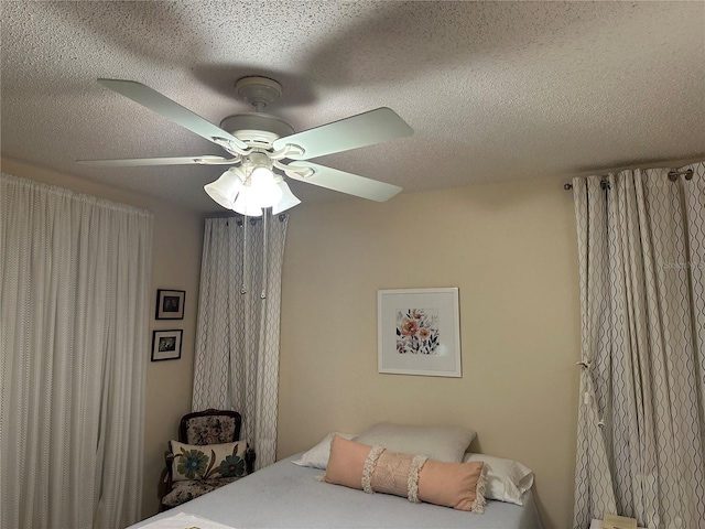 3711 Pinecone Ct Unit 168, Sarasota, FL 34238 - bedroom featuring a textured ceiling and ceiling fan
