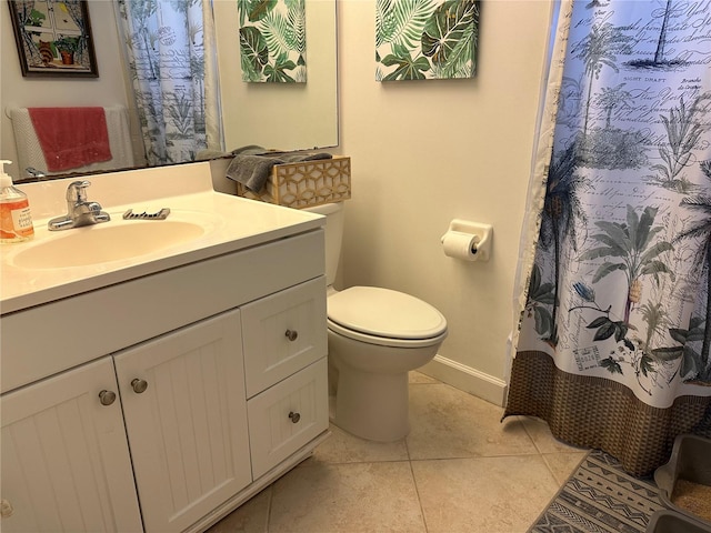 bathroom with toilet, vanity, tile patterned floors, and walk in shower