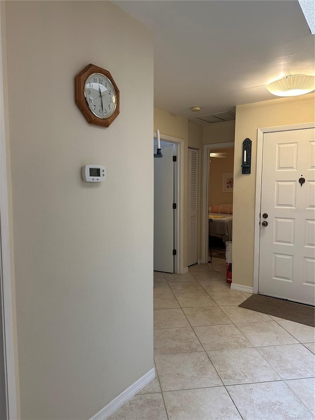 hallway featuring light tile patterned flooring