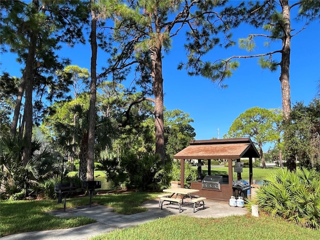 3711 Pinecone Ct Unit 168, Sarasota, FL 34238 - view of home's community featuring a gazebo, a patio area, area for grilling, and a yard