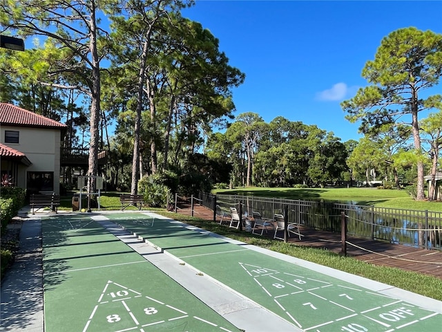3711 Pinecone Ct Unit 168, Sarasota, FL 34238 - view of home's community with shuffleboard and view of wooded area