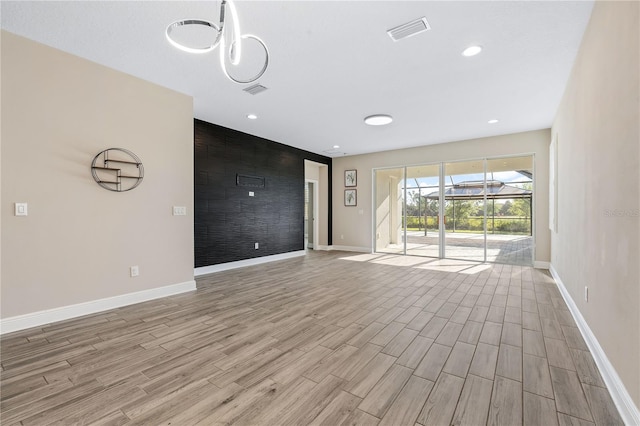 unfurnished living room with light hardwood / wood-style flooring