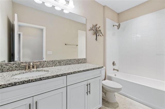 full bathroom with tile patterned flooring, vanity, toilet, and tiled shower / bath combo