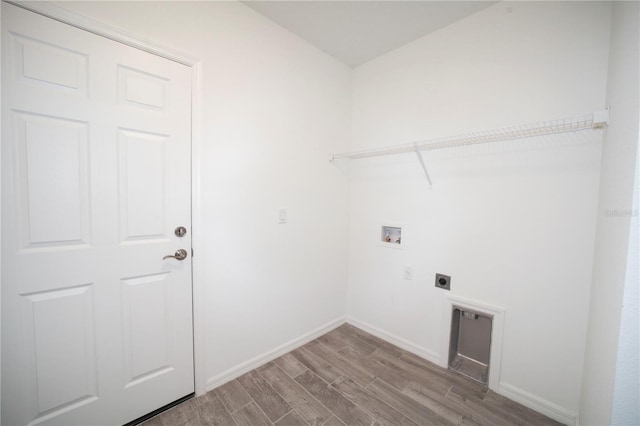 washroom with hookup for a washing machine, electric dryer hookup, and hardwood / wood-style flooring