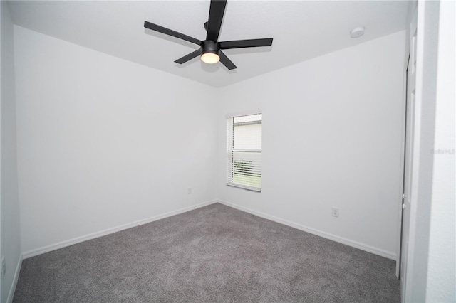 empty room featuring ceiling fan and carpet floors