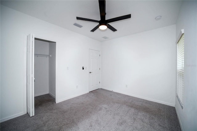 unfurnished bedroom featuring ceiling fan, a closet, and carpet floors