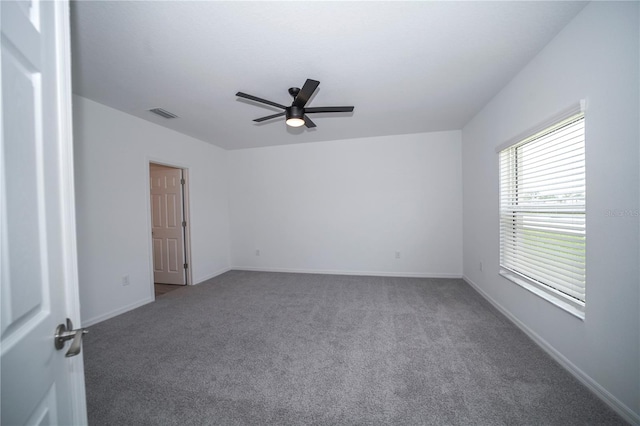 carpeted empty room with ceiling fan