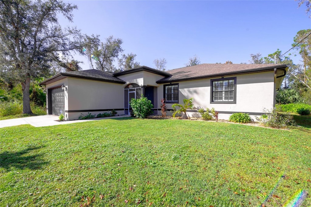 single story home with a front lawn and a garage