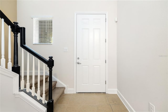 foyer with light tile patterned floors