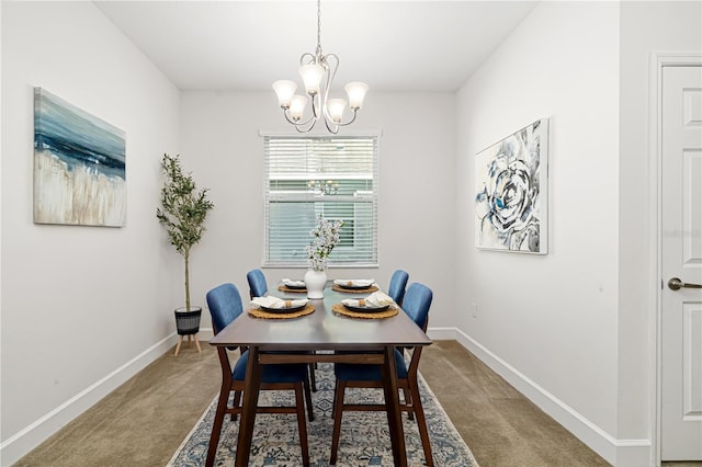 carpeted dining room featuring a notable chandelier