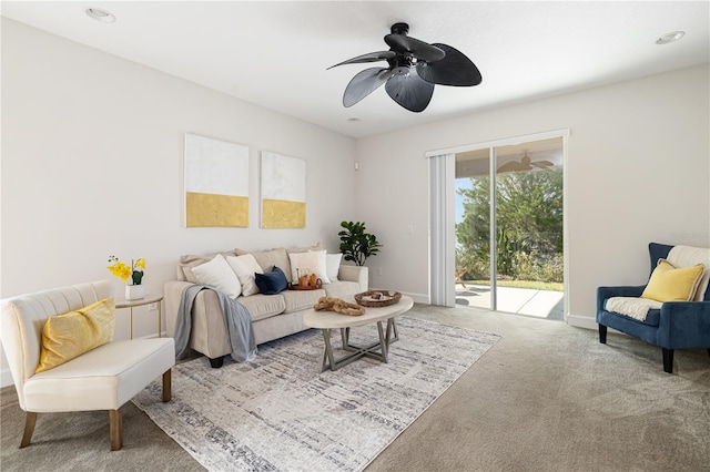 living room featuring light colored carpet and ceiling fan