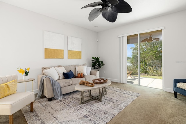 living room featuring ceiling fan and carpet