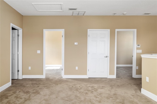 unfurnished bedroom with light colored carpet