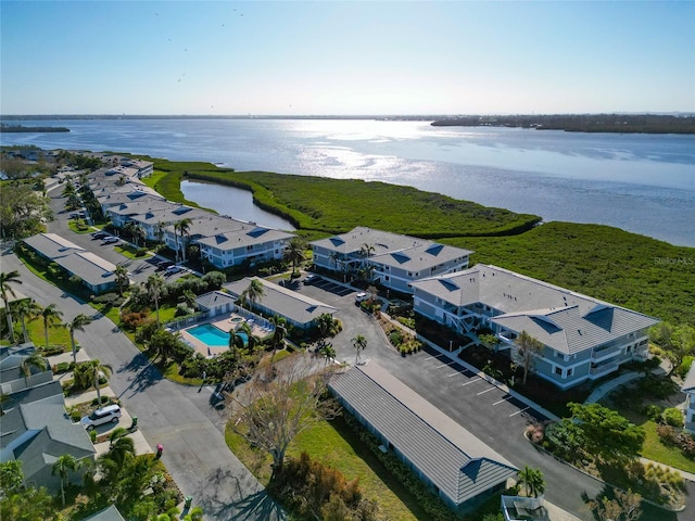 birds eye view of property with a water view