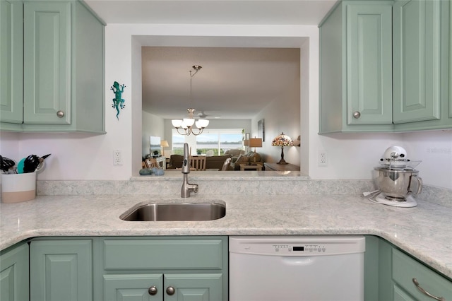 kitchen with dishwasher, green cabinets, a notable chandelier, sink, and decorative light fixtures