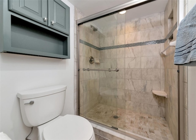 bathroom with walk in shower and toilet