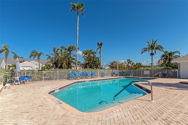 view of swimming pool featuring a patio area