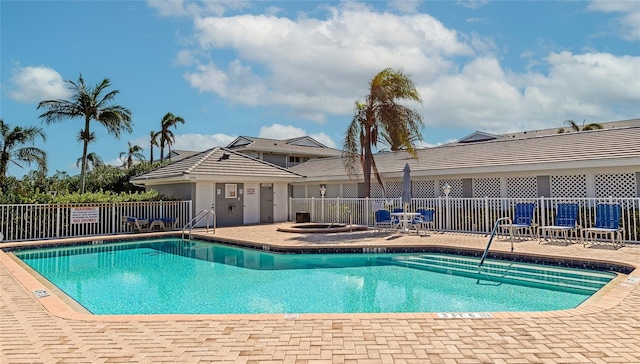 view of swimming pool with a patio area