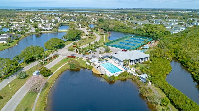 birds eye view of property with a water view