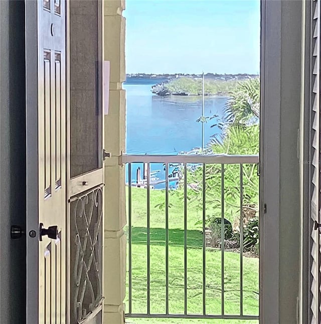 balcony featuring a water view