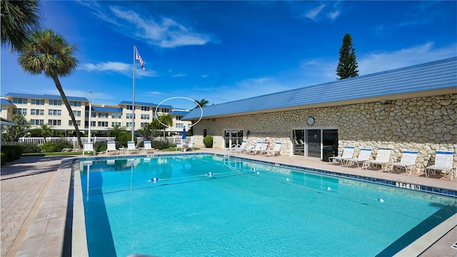 view of swimming pool featuring a patio area