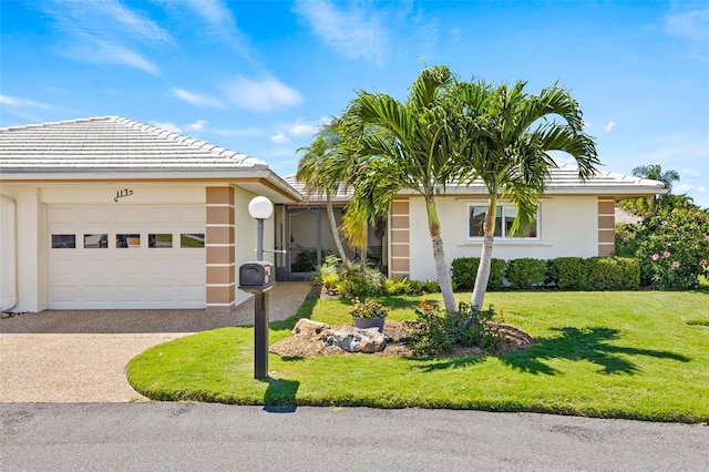 single story home with a garage and a front yard