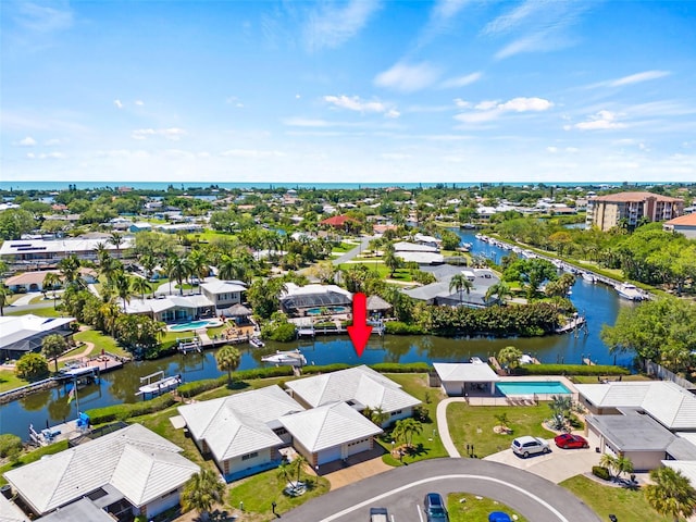 birds eye view of property featuring a water view