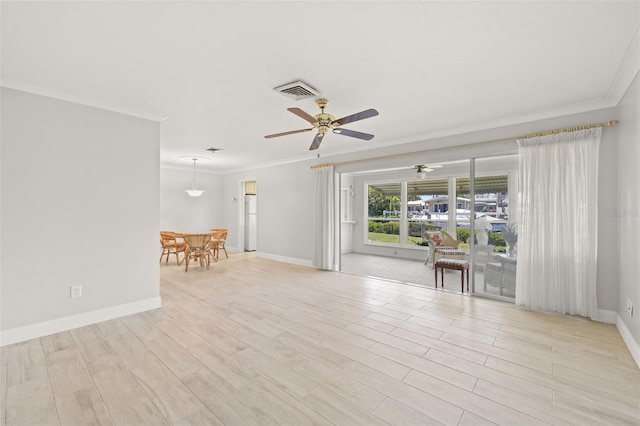 unfurnished room featuring ornamental molding, ceiling fan, and light hardwood / wood-style floors