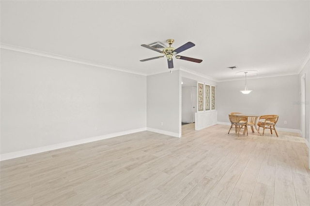 spare room featuring ceiling fan, crown molding, and light hardwood / wood-style flooring