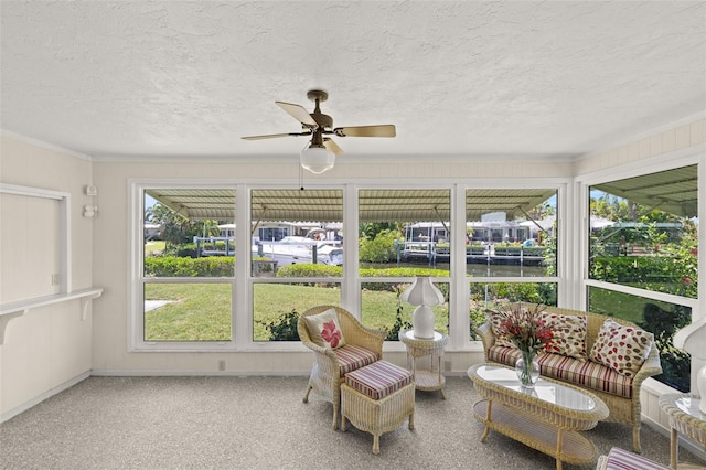 sunroom featuring ceiling fan