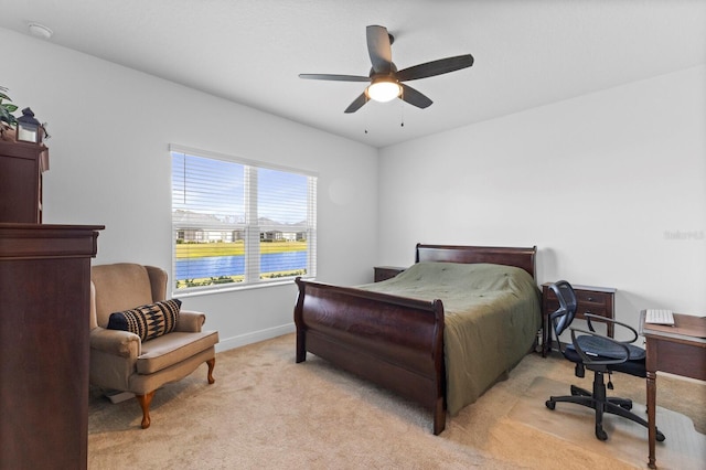 14538 Barefoot Ln, Parrish, FL 34219 - bedroom with light colored carpet, baseboards, and ceiling fan