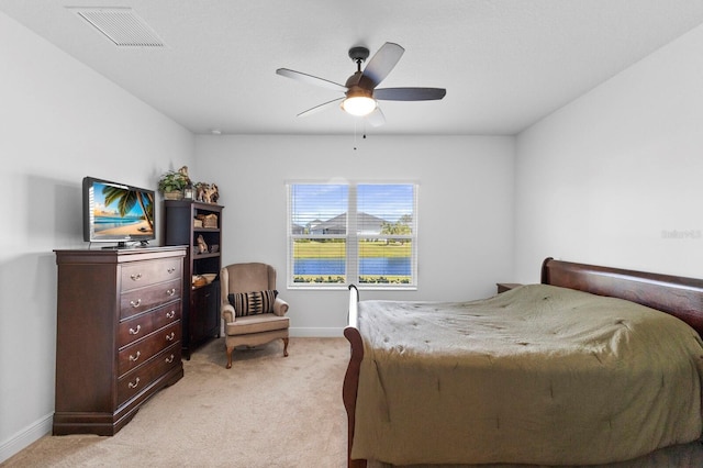 14538 Barefoot Ln, Parrish, FL 34219 - bedroom with light colored carpet, baseboards, and a ceiling fan
