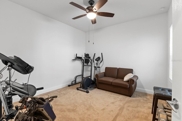 workout room featuring ceiling fan and light colored carpet