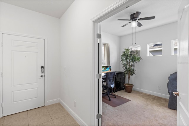 interior space with ceiling fan