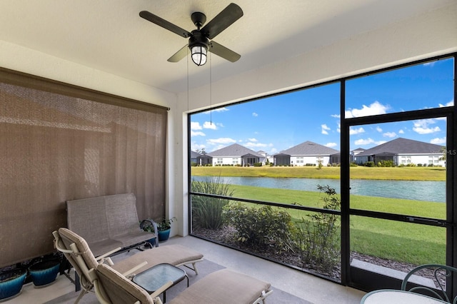 14538 Barefoot Ln, Parrish, FL 34219 - sunroom featuring a water view, ceiling fan, and a residential view