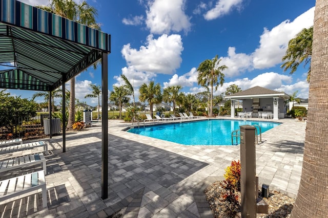 14538 Barefoot Ln, Parrish, FL 34219 - community pool featuring a patio area